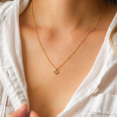 Gold flower charm necklace