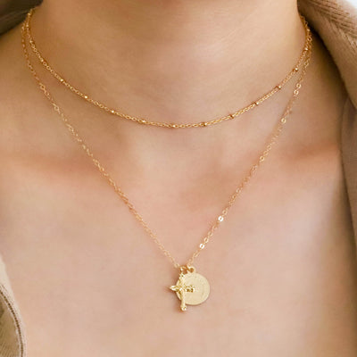 Gold dainty cross and coin necklace