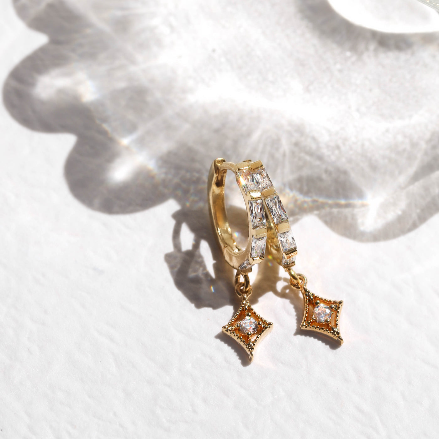 Gold diamond huggie earrings