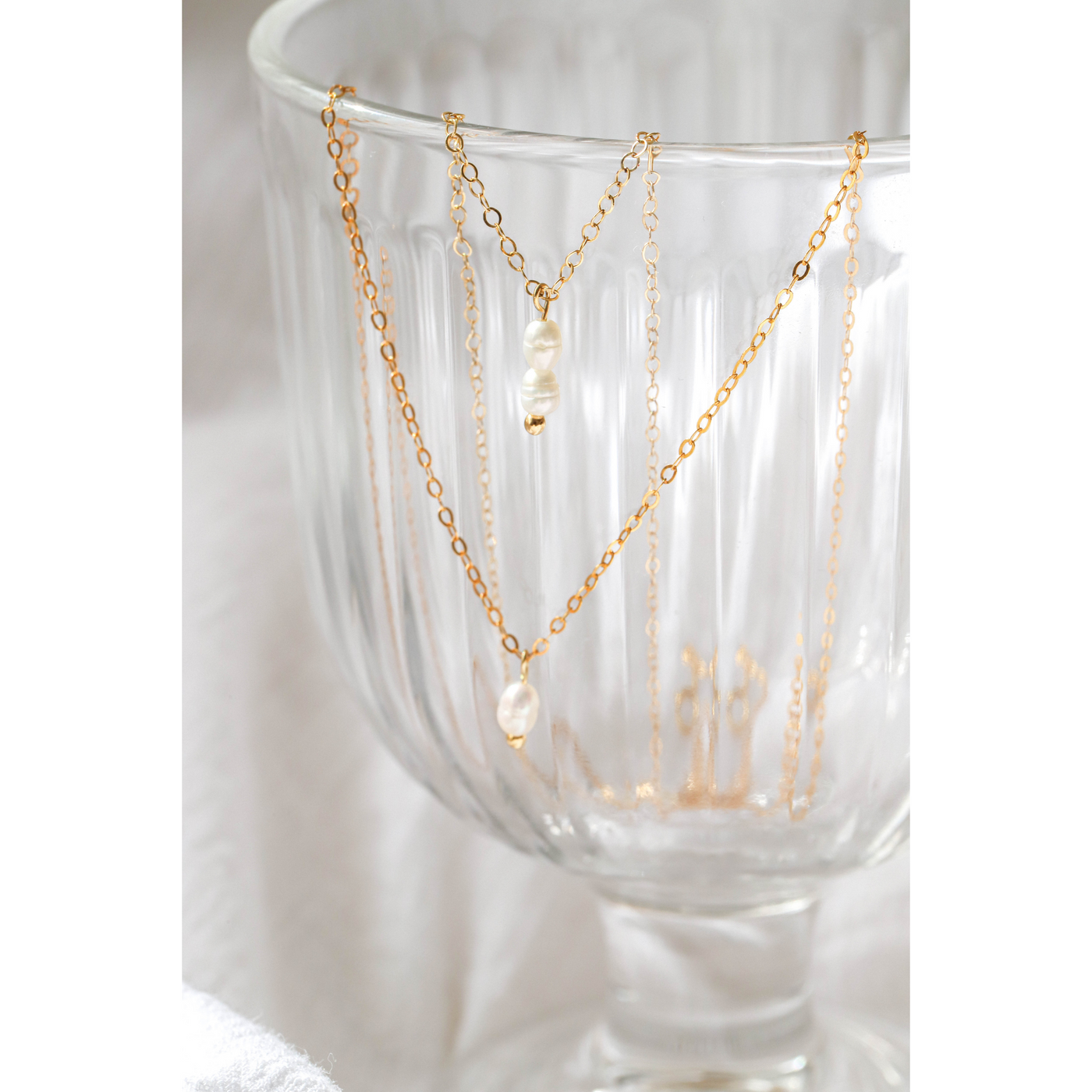 Gold necklace with pearl charms