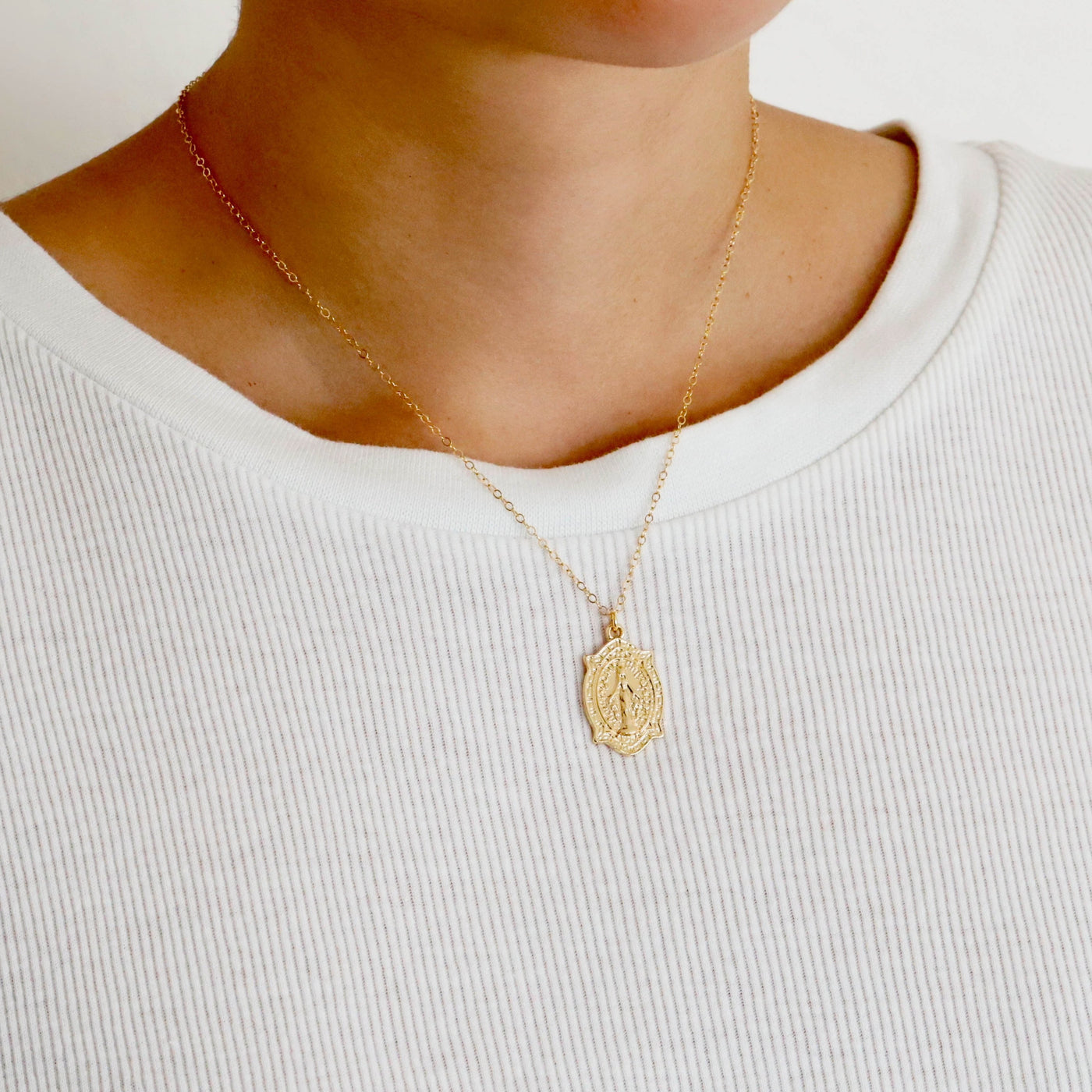Gold religious pendant necklace